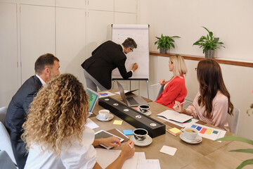 Group of colleagues working in modern workspace