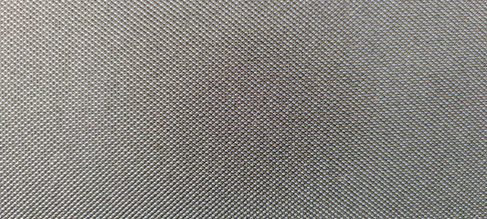 Close-up view of dark gray textile textured background. Abstract fabric material pattern. Copy...