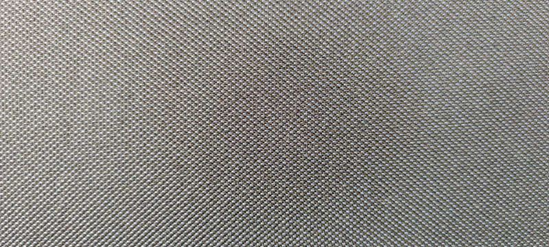Close-up view of dark gray textile textured background. Abstract fabric material pattern. Copy space for your text or decoration.