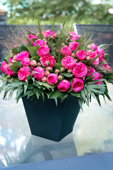A beautiful bouquet of  vibrant pink Pomponella roses