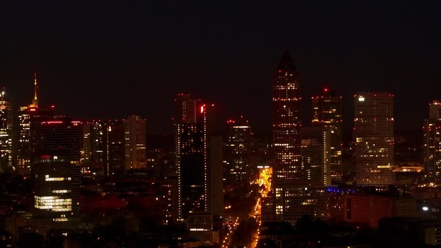 Drone time lapse of Frankfurt skyline at night with rising full moon
