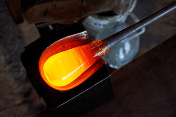 Glob of molten glass on blowpipe