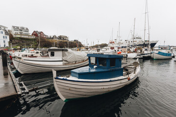 Fototapeta na wymiar boats in the harbor of Torshavn, capital of Faroe Islands