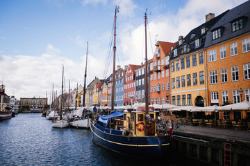 Beautiful canal full of boats and colorful buildings in the background Copenhagen Denmark - 635212953