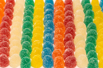 Assorted colorful gummy candies isolated on a white background.