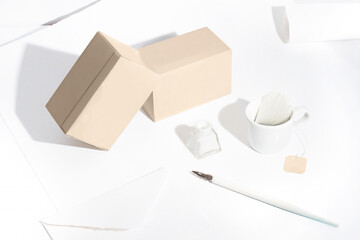 Composition with tea boxes, a writing pen and ink