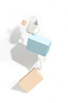 Balancing composition with boxes and a white tea cup