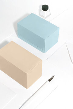 Composition with tea boxes, a writing pen and ink