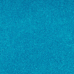 Trendy sparkly blue glitter texture background. Minimal background concept. Creative texture background idea. Flat lay, top of view.