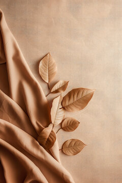 Generative AI illustration of top view of autumn background with brown leaves placed near napkin against pale surface