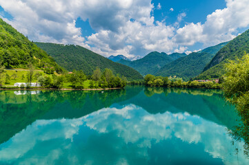 Fototapeta na wymiar A view across the Lake at Most na Soci in Slovenia in summertime
