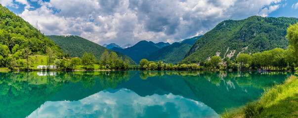 Fototapeta na wymiar A panorama view across the Lake at Most na Soci in Slovenia in summertime
