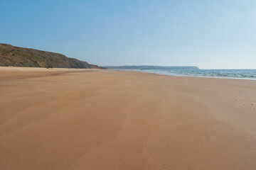 Fototapeta na wymiar Endless sands of the Praia da Bordeira. West of the Algarve coast, Portugal