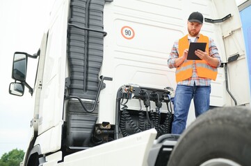 Logistics - proud driver with tablet computer. - obrazy, fototapety, plakaty