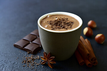 Spicy hot chocolate with ingredients for making.