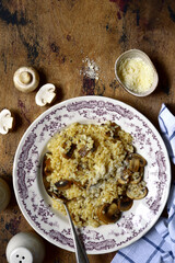 Risotto with mushrooms and cheese. Top view with copy space.