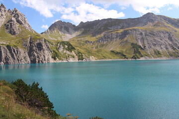 Beautiful view of Lake Lunersee surrounded by Alps in Vorarlberg, Austria