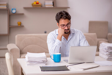 Young businessman employee working from home during pandemic