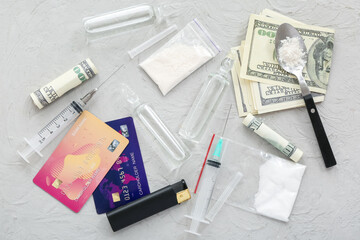 Composition with drugs, syringes, credit cards and money on grey background