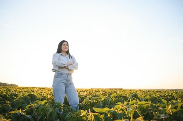 A female farmer in soybean field © Serhii