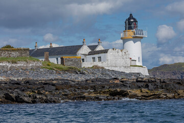 Lighthouse and its buildings on a scottish island