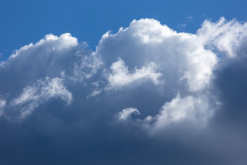 Cumulonimbus clouds in the blue sky. Nature. Meteorology. Weather. Global warming.