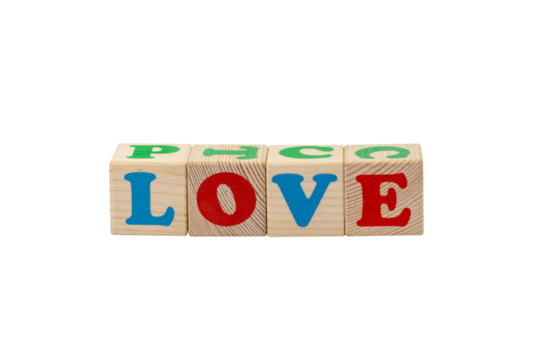 Children's wooden cubes with blue, red and green letters with the word love lying side by side. No background. High quality photo.