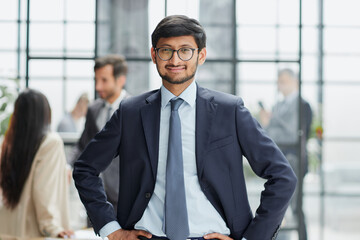 Handsome young business man standing confident in the office