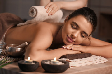 Fototapeta na wymiar Beautiful woman receiving spa massage in salon