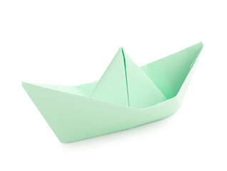 Green origami boat on white background