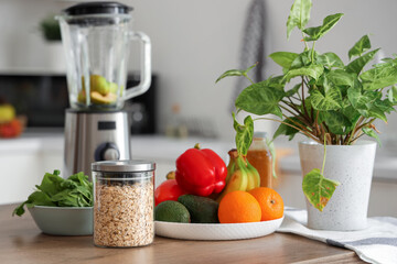 Jar of oat flakes and fresh vegetables on table in kitchen, closeup