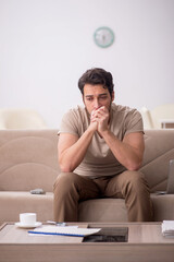 Young man working from home during pandemic