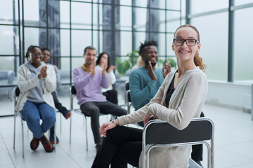 Partial view of business people listening to mentor during business training in office