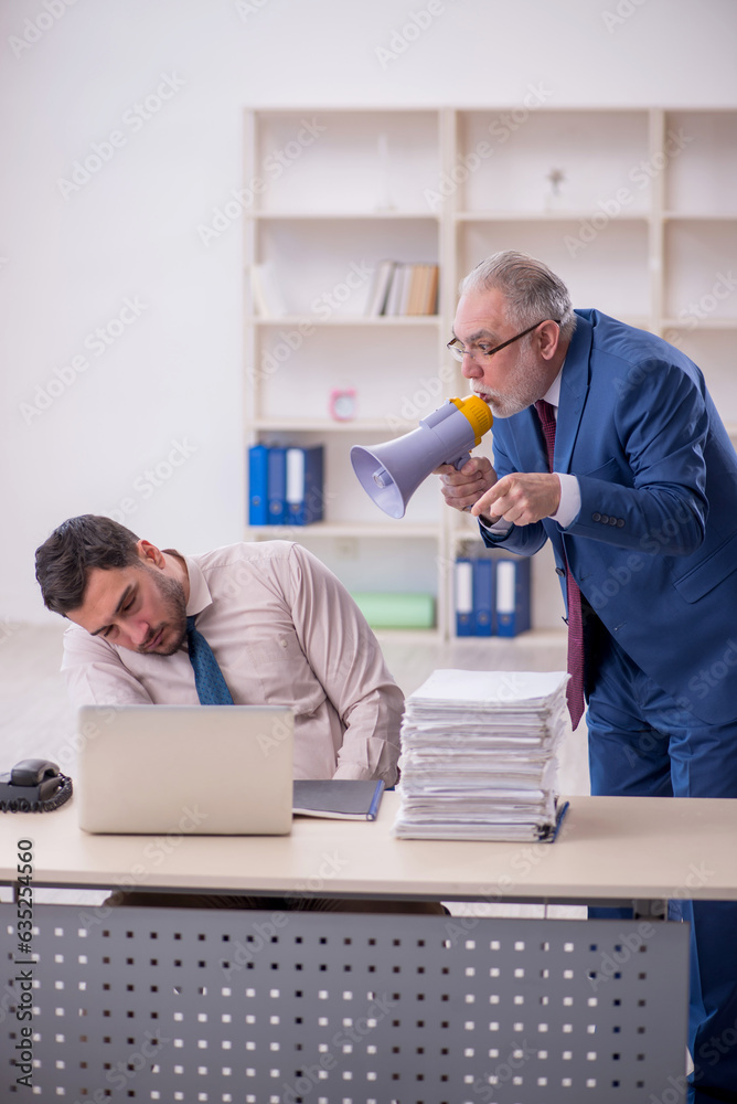 Canvas Prints Old male boss and young male employee in bullying concept