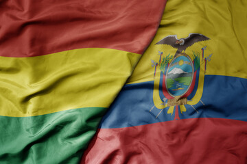 big waving realistic national colorful flag of bolivia and national flag of ecuador .