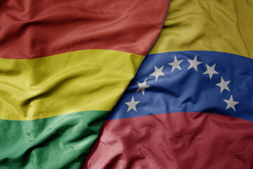 big waving realistic national colorful flag of bolivia and national flag of venezuela .