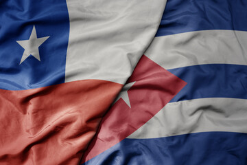 big waving realistic national colorful flag of chile and national flag of cuba .