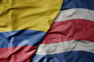 big waving realistic national colorful flag of colombia and national flag of costa rica .
