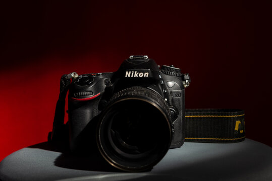 A Nikon brand DSLR camera, model D7100 with Nikkor 16-85mm f/3.5 lens.
