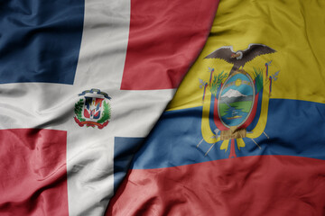 big waving realistic national colorful flag of dominican republic and national flag of ecuador .