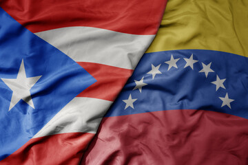 big waving realistic national colorful flag of puerto rico and national flag of venezuela .