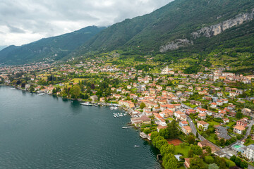 Fototapeta premium Aerial Drone View of Buildings Along the Shore in Tremezzo in Lake Como Italy