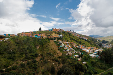 Fototapeta na wymiar Precarious houses on top of a hill in El Mirador on the outskirts of Bogota