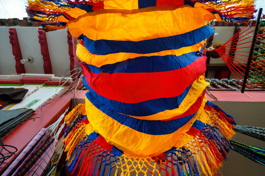 View from below of a hammock with the Colombian flag hanging in a shop in Raquira, Colombia