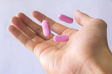 pill in hand with white background isolated
