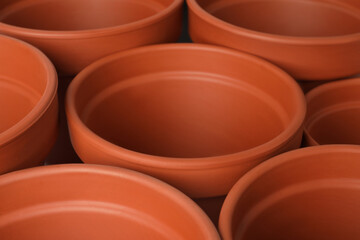 Many clay flower pots as background, closeup