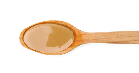 Wooden spoon with tasty peanut butter isolated on white, top view