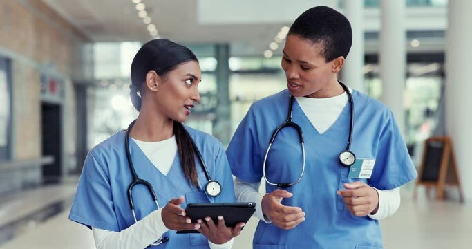 Nurses, tablet and walking in a hospital for medical planning, discussion and internet. Healthcare women working together with collaboration, teamwork or technology for doctor app, medicine and care