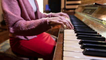 Young female hands on Vintage Piano. Close up, copy space.