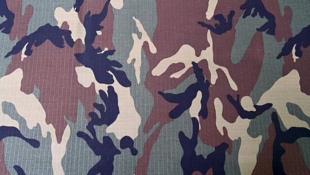 Army camouflage uniform, detail. Texture of military camouflage textile.